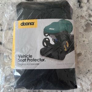 New in Bag Doona chile seat protector